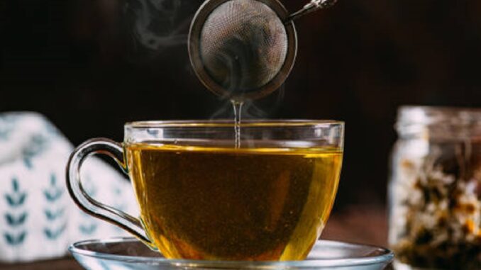 Chamomile Tea on Rustic Wooden Background